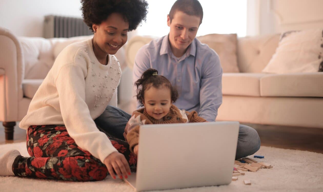 Family exploring online speech therapy together at home