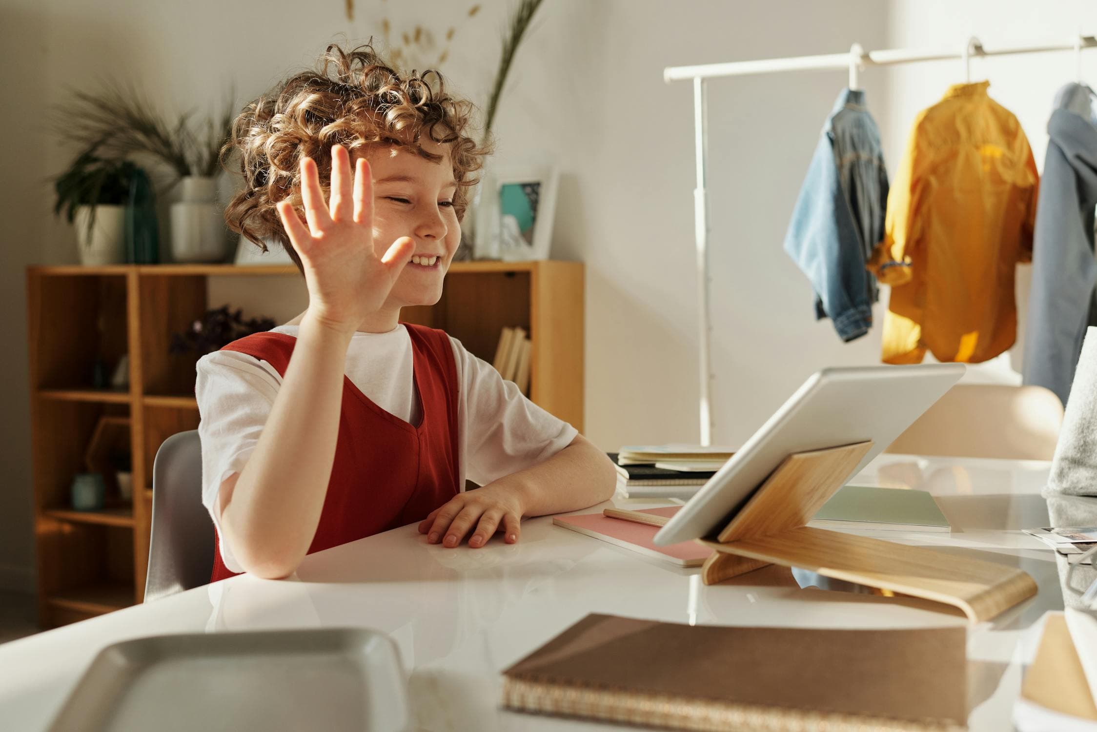 Parent and child watching a webinar together on a laptop