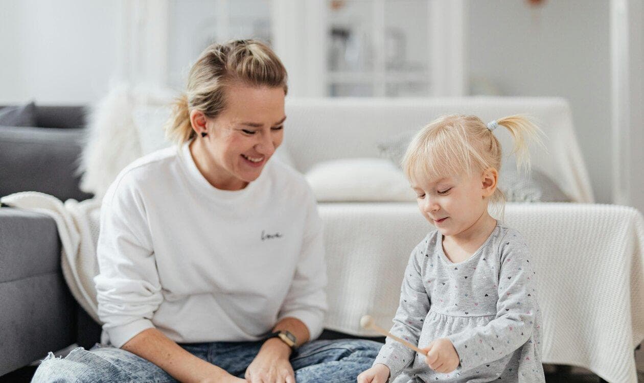 Parent playing with a toddler at home